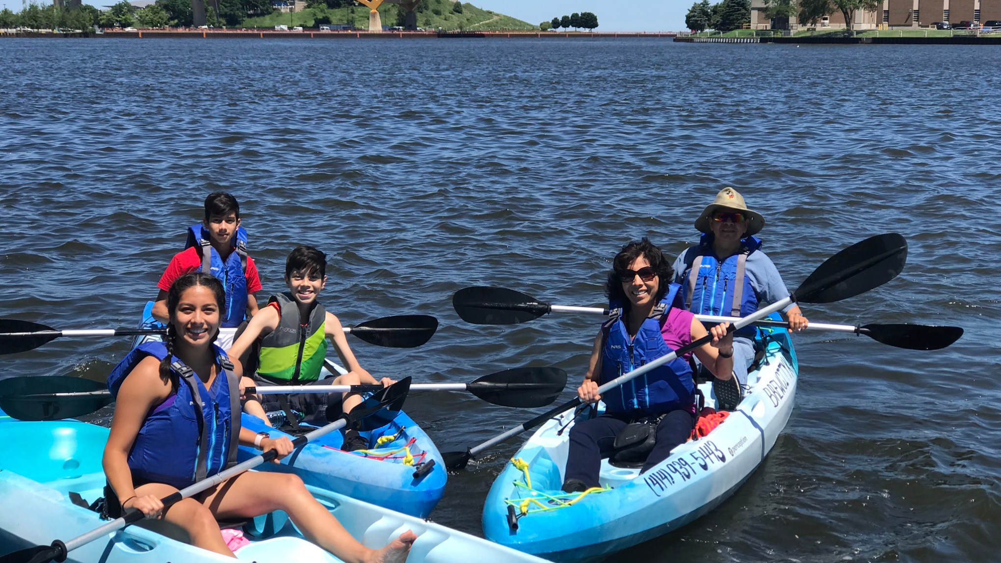 A family in their kayaks on Lake Michigan