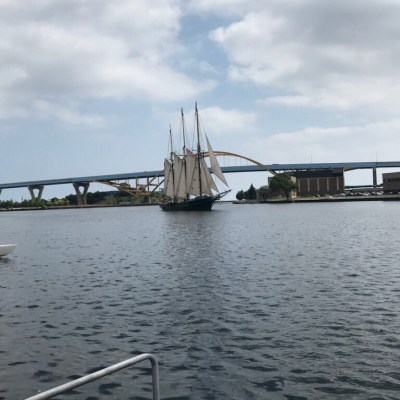 An old time ship with huge sails on Lake Michigan